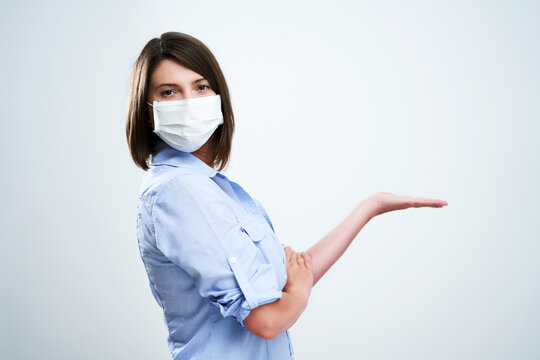 Attractive Woman Wearing Protective Mask Isolated Over White Background