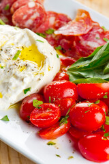 Lobster, mussels, clams and shrimp. Classic Italian restaurant entree favorite. Seafood stew baked in wood fire over and severed with olive oil, lemons and garnished with Italian parsley.