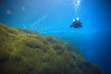 Naklejka na ściany i meble diver breathes air under water bubbles, releases gas, landscape underwater depth