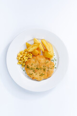 schnitzel with potatoes on white