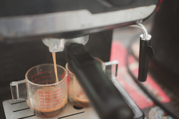 Dual espresso being made from a commercial grade machine in a local coffee shop.