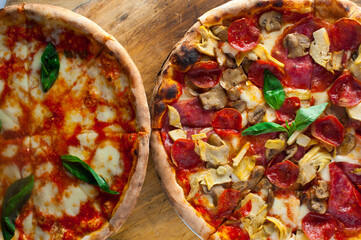 Pizza. Traditional New York City style margarita pizza pie with a thin homemade crispy crust, fresh tomato garlic marinara sauce topped with buffalo mozzarella cheese and fresh basil leaves.