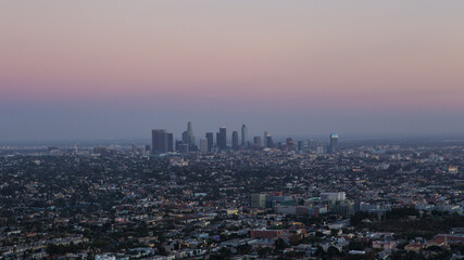 Fototapeta premium The skyline of Los Angele at sunset.