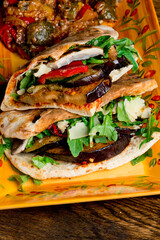 Sandwiches. Roasted and grilled Vegetables served on toasted focaccia bread. Deli style sandwiches with roasted red peppers, squash, basil and pesto spread. Classic American lunch favorite.