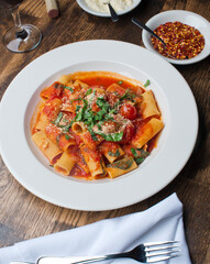 Rigatoni Pasta with meatballs, marinara sauce, Parmesan cheese and fresh Italian parsley. Classic American or Italian restaurant favorite. Homemade pasta with sauces, meats and cheeses.