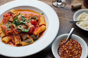 Rigatoni Pasta with meatballs, marinara sauce, Parmesan cheese and fresh Italian parsley. Classic American or Italian restaurant favorite. Homemade pasta with sauces, meats and cheeses.