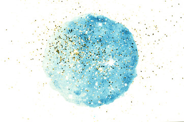 Golden glitter on abstract round blue watercolor splash on white background	