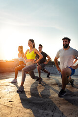 Portrait of smiling fit happy people doing power fitness exercise - obrazy, fototapety, plakaty