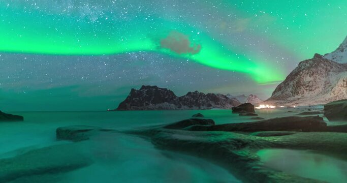 4K,10bit,422,timelapse video of Uttakleiv starry night sky with northern light aurora and snow mountain, Lofoten,Norway