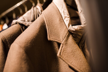 Men's clothing store. Men's outerwear on a hanger in a store, smart look, close-up