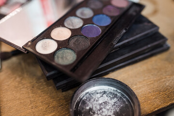 Makeup cosmetics in the beauty salon close up. Different focus