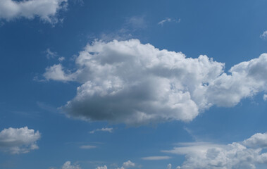Cumulus scape white fluffy clouds in the blue sky with beautiful cloud sunny day.