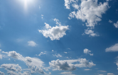 Naklejka na ściany i meble Beautiful blue azure sky with an amazing of white fluffy clouds.