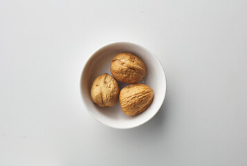 top view shot of walnut on white background.