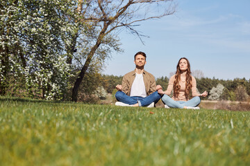 Smiling young man and woman resting outdoors