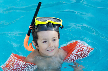 boy learning to swim