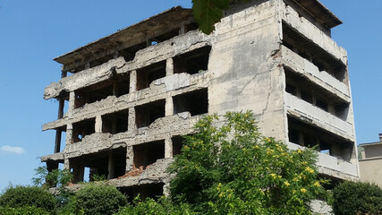 .Sniper tower vantage point in the Bosnian war- bullet riddled abandoned multi-storey building