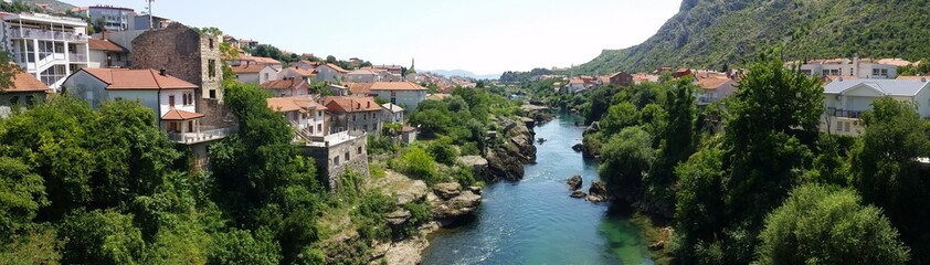 Fototapeta na wymiar Mostar, a historic town spanning a deep valley of the Neretva River