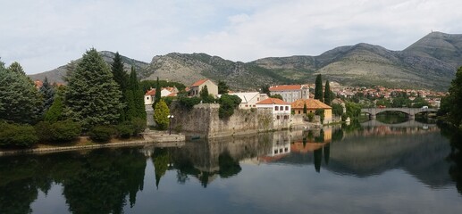 Fototapeta na wymiar Trebinje, reflected on the Trebišnjica river in Bosnia