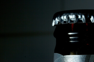 beer bottle cap in macro with black background