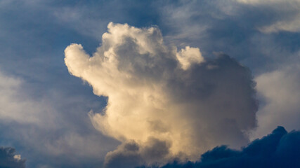 Сumulus clouds in the form of an elephant and monsters