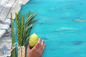 Jewish festival of Sukkot. Traditional symbols (The four species): Etrog (citron), lulav (palm...