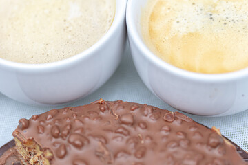 Close-up cups of coffee with chocolate cake