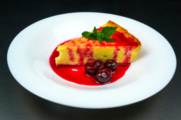 Cottage cheese casserole decorated with cherries