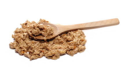 Cat food with chicken and carrot chunks with wooden spoon isolated on white background