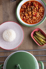 Kuru Fasulye, in a white plate, Turkish traditional food with tursu