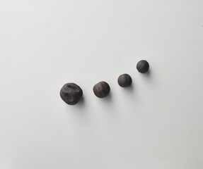 Top view shot of dried lime on white background.
loomi, limoo amani, black lime, persian lime