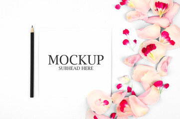 mockup of white notebook and beautiful flower petals