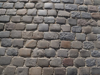 Some cobbles of a small street in the center of Paris. (square dauphine - july 2020)