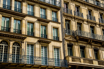 Fototapeta na wymiar A typical parisian facade of a residential building in the center of the Paris. 