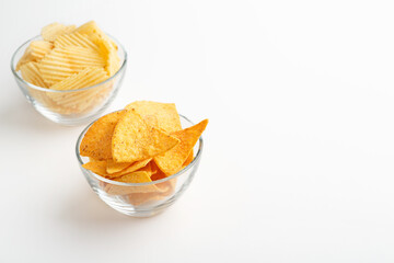 Snack to beer. Nachos and chips in glass plates