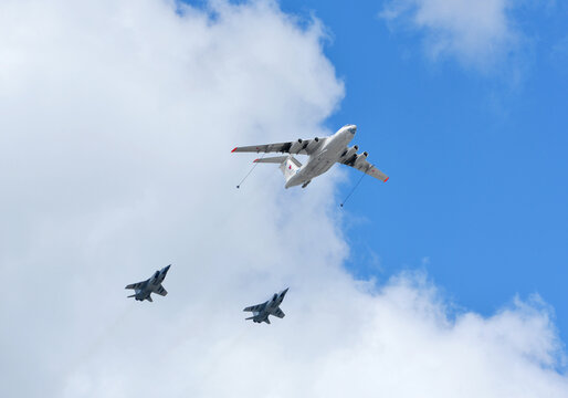 Russian Air Force IL-78 air-to-air refueling tanker demonstrates in-flight refueling of Mikoyan MiG-31 strategic bomber during rehearsal for Victory Day military parade