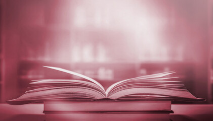 Imagine a picture book of an ancient book opened on a wooden table with a sparkling golden background. With magical power, magic, lightning around a glowing glowing book In the room of darkness