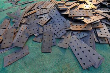 steel plates with holes stacked together