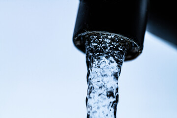 Naklejka na ściany i meble hand splashing in water close-up. High quality photo.