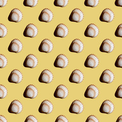Seamless pattern of seashells on a yellow background.