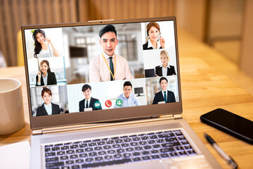 closeup  laptop computer screen with business group video conference