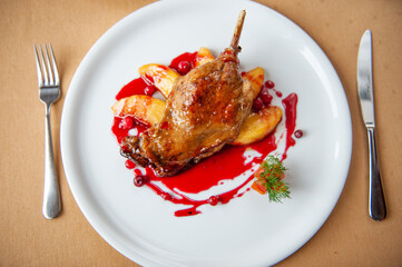 duck leg with apples in cranberry sauce