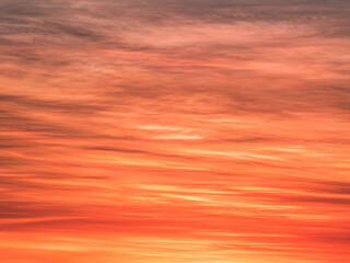 Abstract of red and golden sunrise and soft clouds
