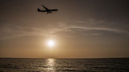 Fototapeta na wymiar Sunset Plane
