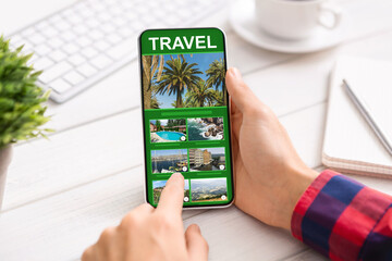 Man Using Smartphone With Online Travel App In Office, Exploring Future Destinations