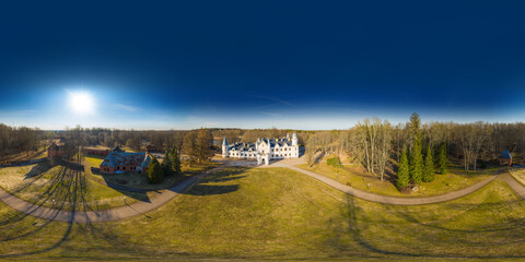 An aerial drone view of the Alatskivi Castle. Dating  to the 17th century, Neo-Gothic castle situated in Alatskivi Parish, Tartu County, Estonia. 360 degrees panorama
