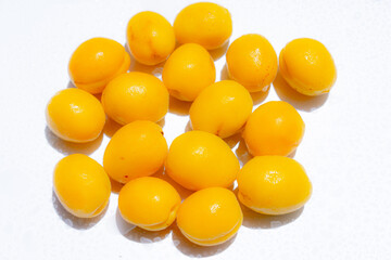 Ripe apricots on a white background