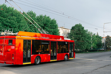 Fototapeta na wymiar Trolley rides along the street