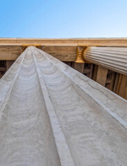 Athens Greece, looking up the ceiling of the national university entrance against blue sky, strong bokeh