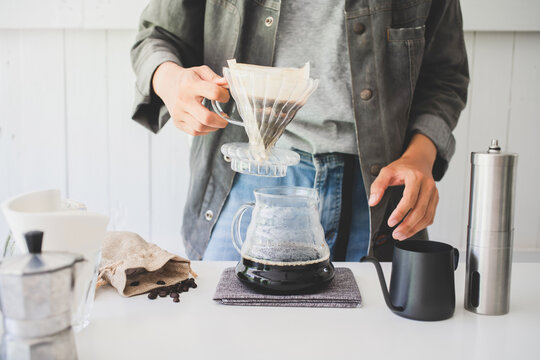 Close Up. Roasted Coffee On Coffee Percolator With Professional Of A Barista Making Coffee For Dripping Hot Coffee Into The Cup With Equipment, Tool Brewing At Kitchen Home